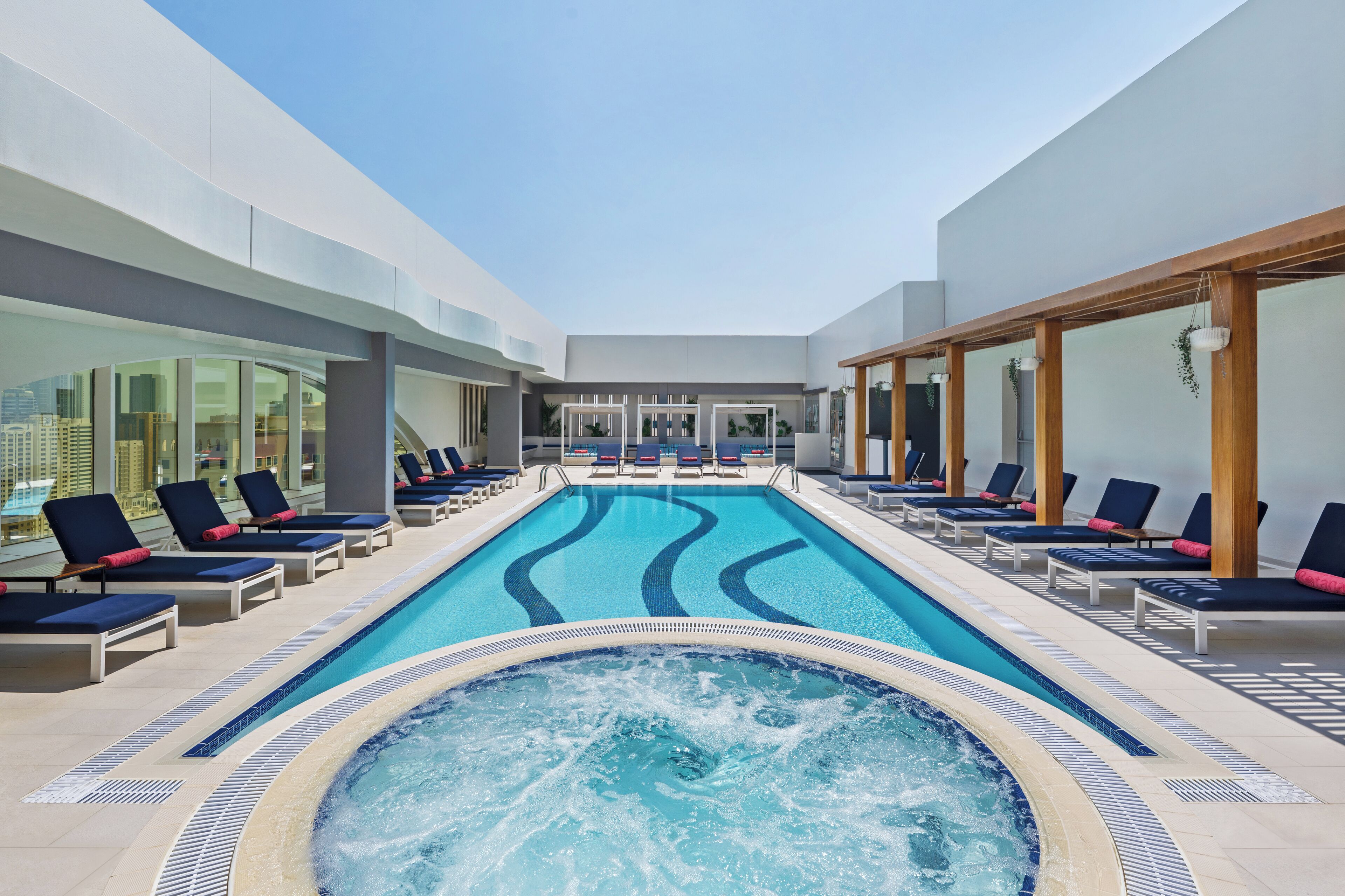 Outdoor pool, open 7:00 AM to 10:00 PM, free cabanas, pool umbrellas