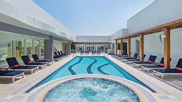 Outdoor pool, open 7:00 AM to 10:00 PM, free cabanas, pool umbrellas