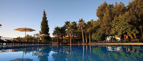 Indoor pool, outdoor pool, pool umbrellas