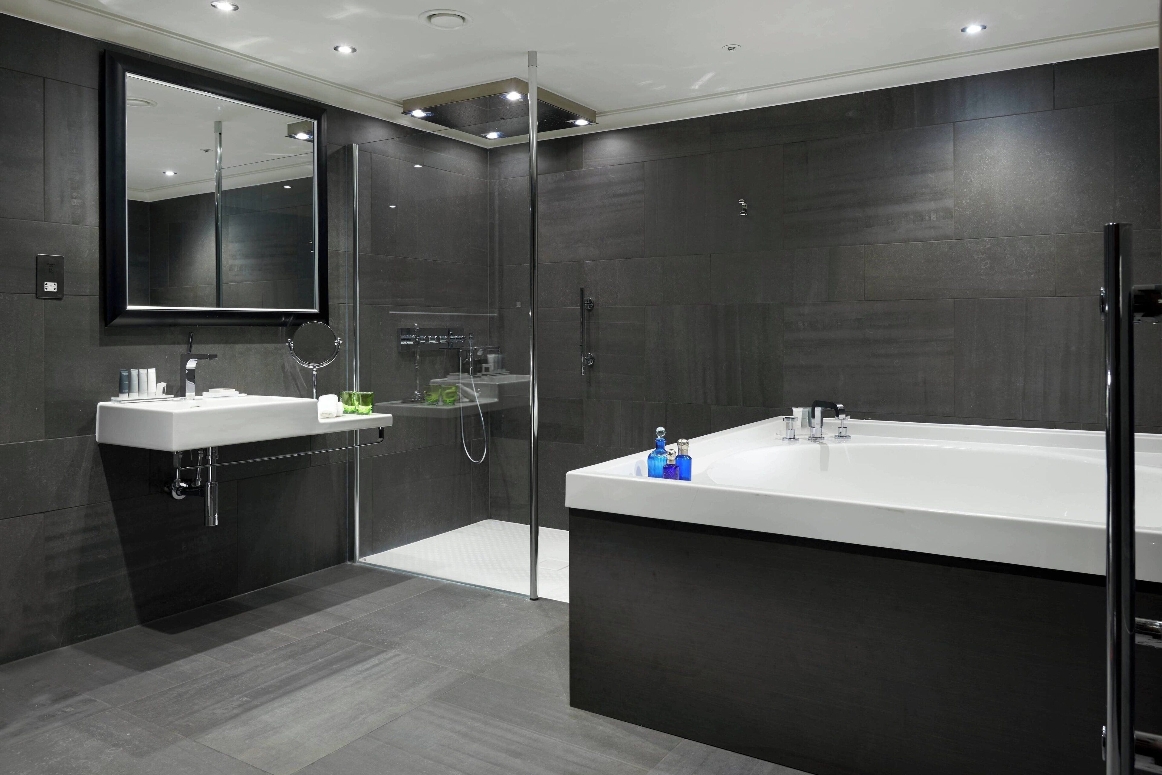 separate bathtub and shower, designer toiletries, hair dryer, bathrobes