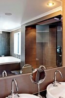 Suite, 1 King Bed, City View | Bathroom | Separate bathtub and shower, designer toiletries, hair dryer, bathrobes