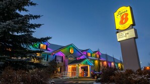 A hotel with a prominent 'Super 8' sign, indicating it is locally owned and operated. - Super 8 by Wyndham Cochrane (Cochrane)