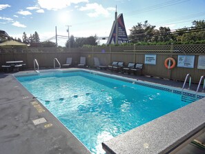 Seasonal outdoor pool, open 7:00 AM to 10:00 PM, pool umbrellas