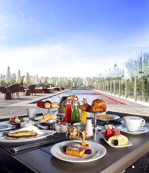 Breakfast, lunch, dinner served; pool views