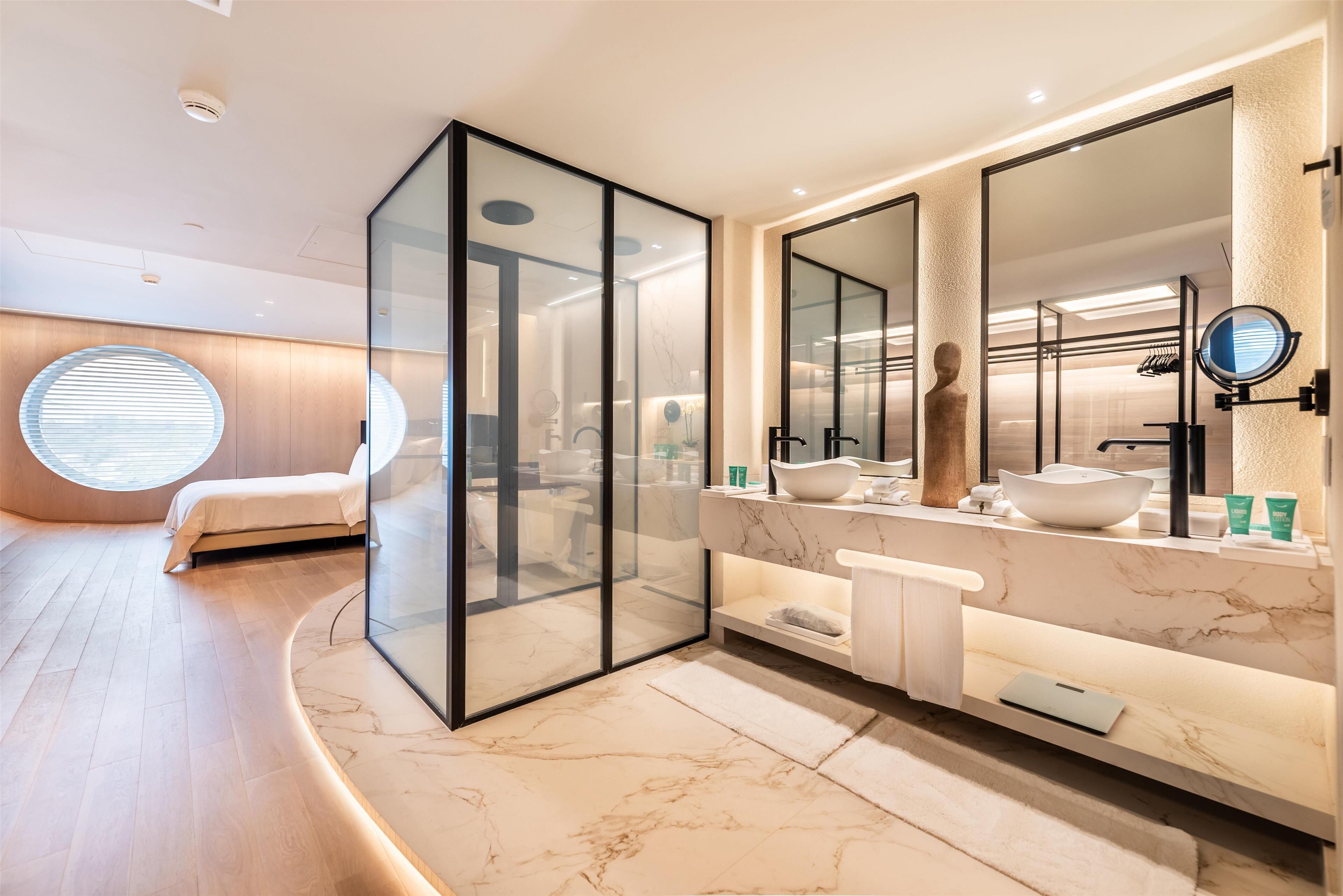 designer toiletries, hair dryer, bathrobes, slippers