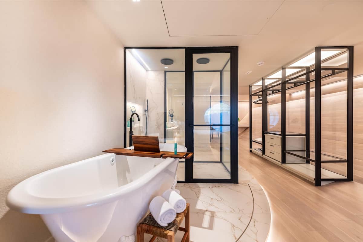 designer toiletries, hair dryer, bathrobes, slippers