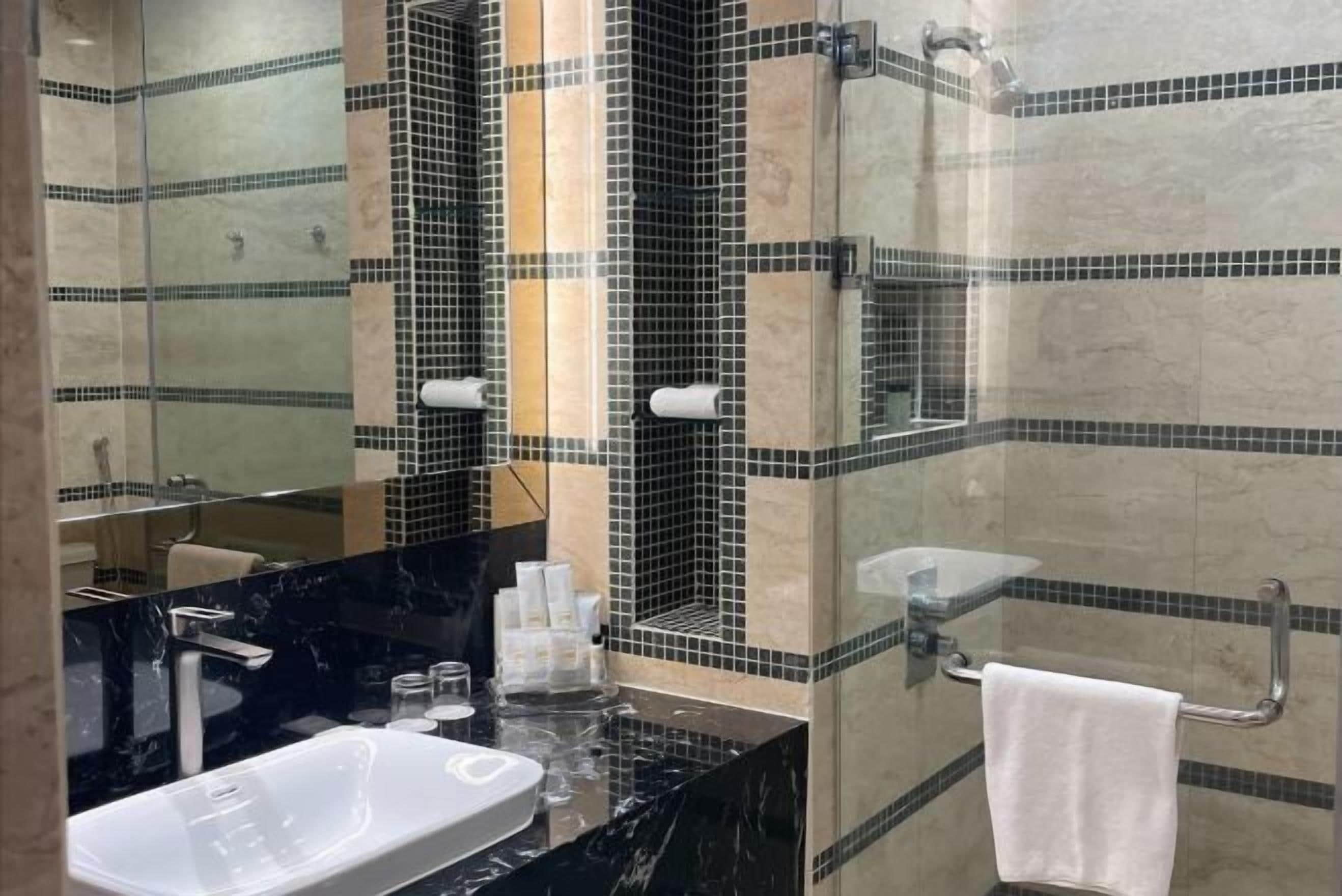 Separate bathtub and shower, free toiletries, hair dryer, bathrobes