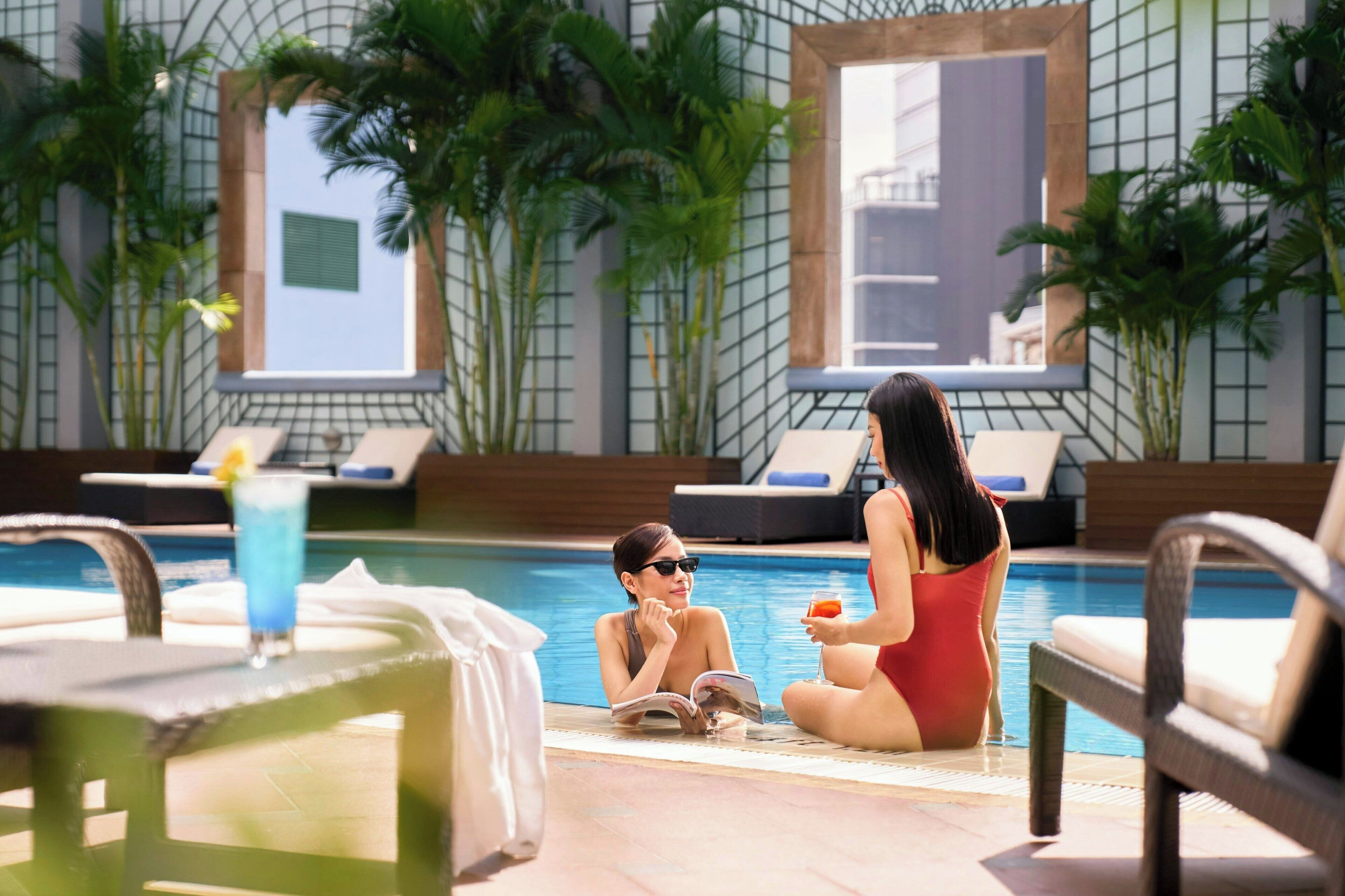 outdoor pool, open 5:30 am to 11:00 pm, pool umbrellas