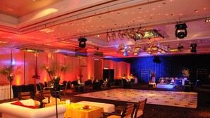 A spacious hall with a stage, tables, and chairs arranged for an event. - Abasto Hotel (Buenos Aires)