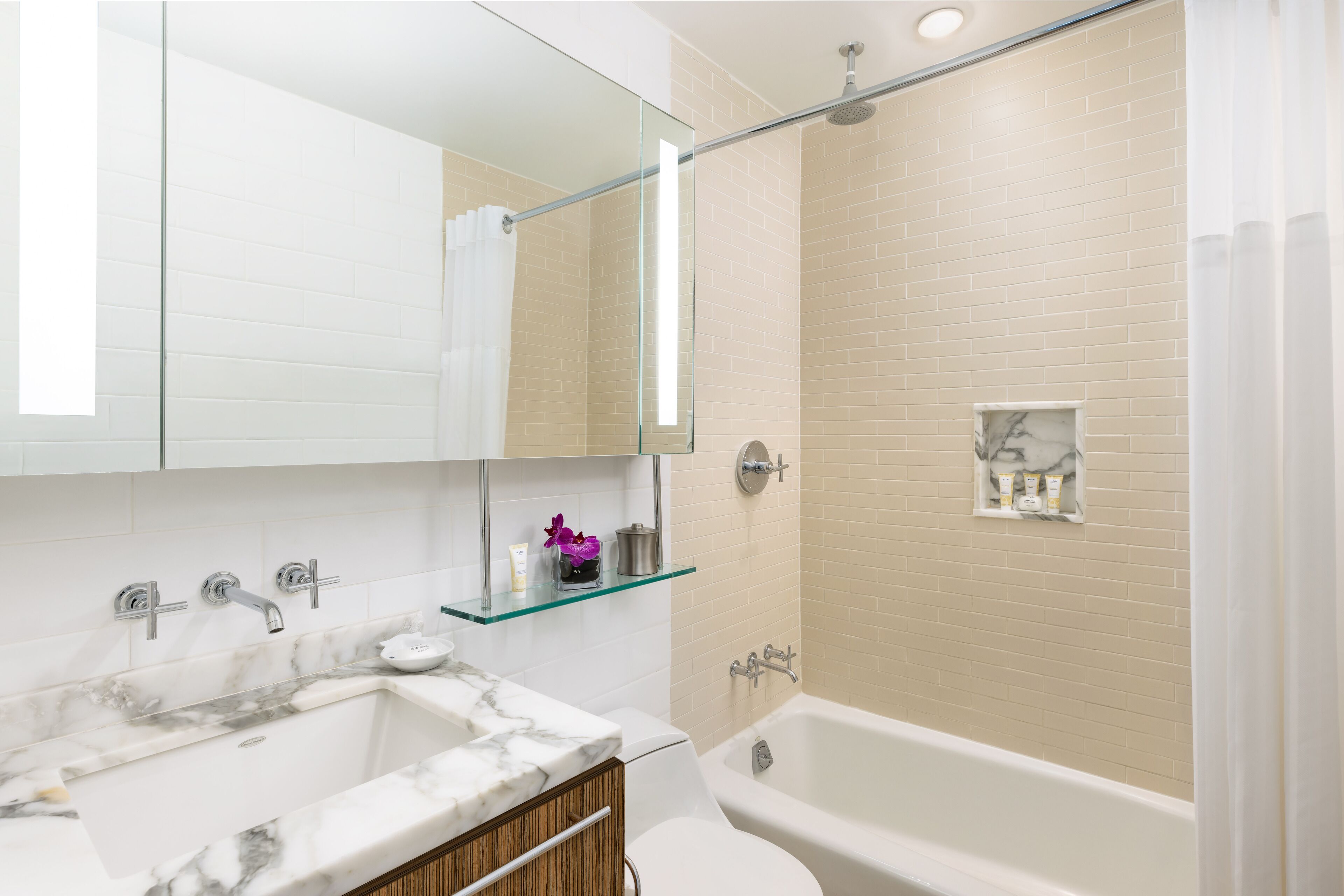 designer toiletries, hair dryer, towels