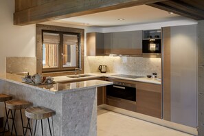 Five-Bedroom Prestige Penthouse | Private kitchen | Full-sized fridge, microwave, oven, stovetop