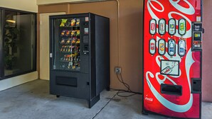 Two vending machines, one with a variety of snacks and the other with beverages. - Red Roof Inn & Suites Fayetteville - Fort Bragg (Fayetteville)