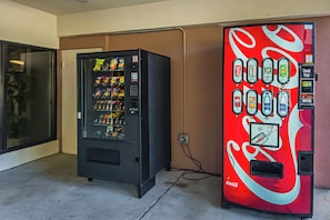 Two vending machines, one with a variety of snacks and the other with beverages. - Red Roof Inn & Suites Fayetteville - Fort Bragg (Fayetteville)