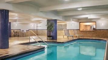 Indoor pool, open 10:00 AM to 10:00 PM, pool loungers