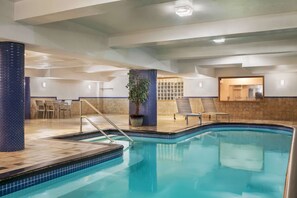 Indoor pool, open 10:00 AM to 10:00 PM, pool loungers