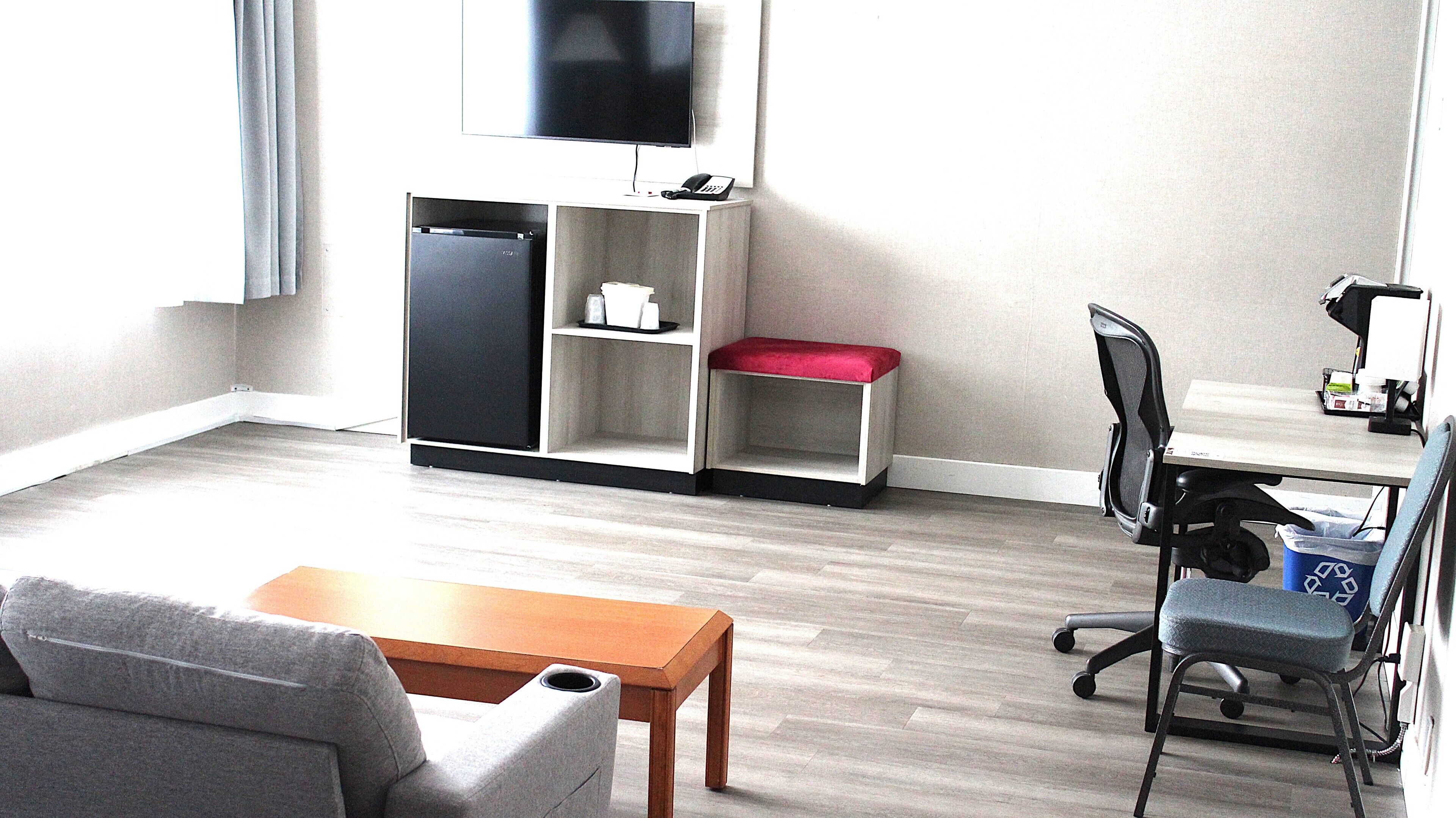 Suite, 1 King Bed, Non Smoking | Desk, laptop workspace, blackout drapes, iron/ironing board