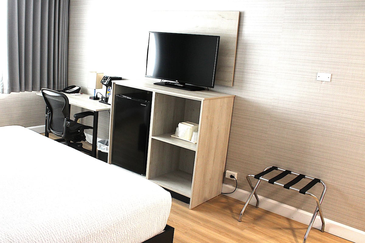 Room, 1 King Bed, Non Smoking | Desk, laptop workspace, blackout drapes, iron/ironing board