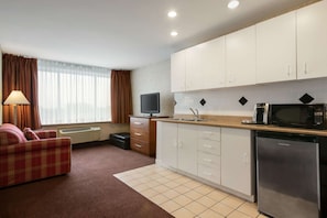 Suite, 2 Queen Beds, Non Smoking | Desk, laptop workspace, iron/ironing board, free cots/infant beds