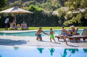 Seasonal outdoor pool, pool umbrellas, pool loungers