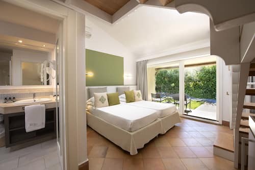 Family Garden Room | 1 chambre, minibar, coffre-fort, rideaux d’obscurcissement