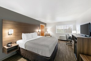 Desk, laptop workspace, blackout curtains, iron/ironing board