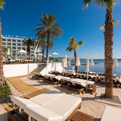 On the beach, sun loungers, beach umbrellas, beach towels