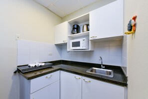 Suite, 2 Bedrooms | Private kitchen | Fridge, microwave, stovetop, coffee/tea maker