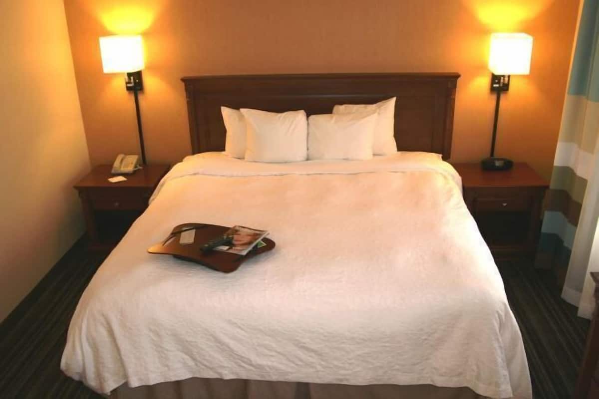 Premium bedding, desk, laptop workspace, blackout curtains