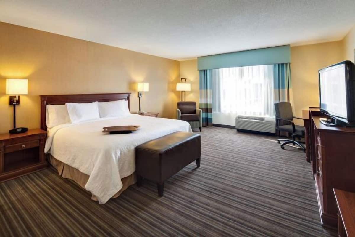Premium bedding, desk, laptop workspace, blackout curtains