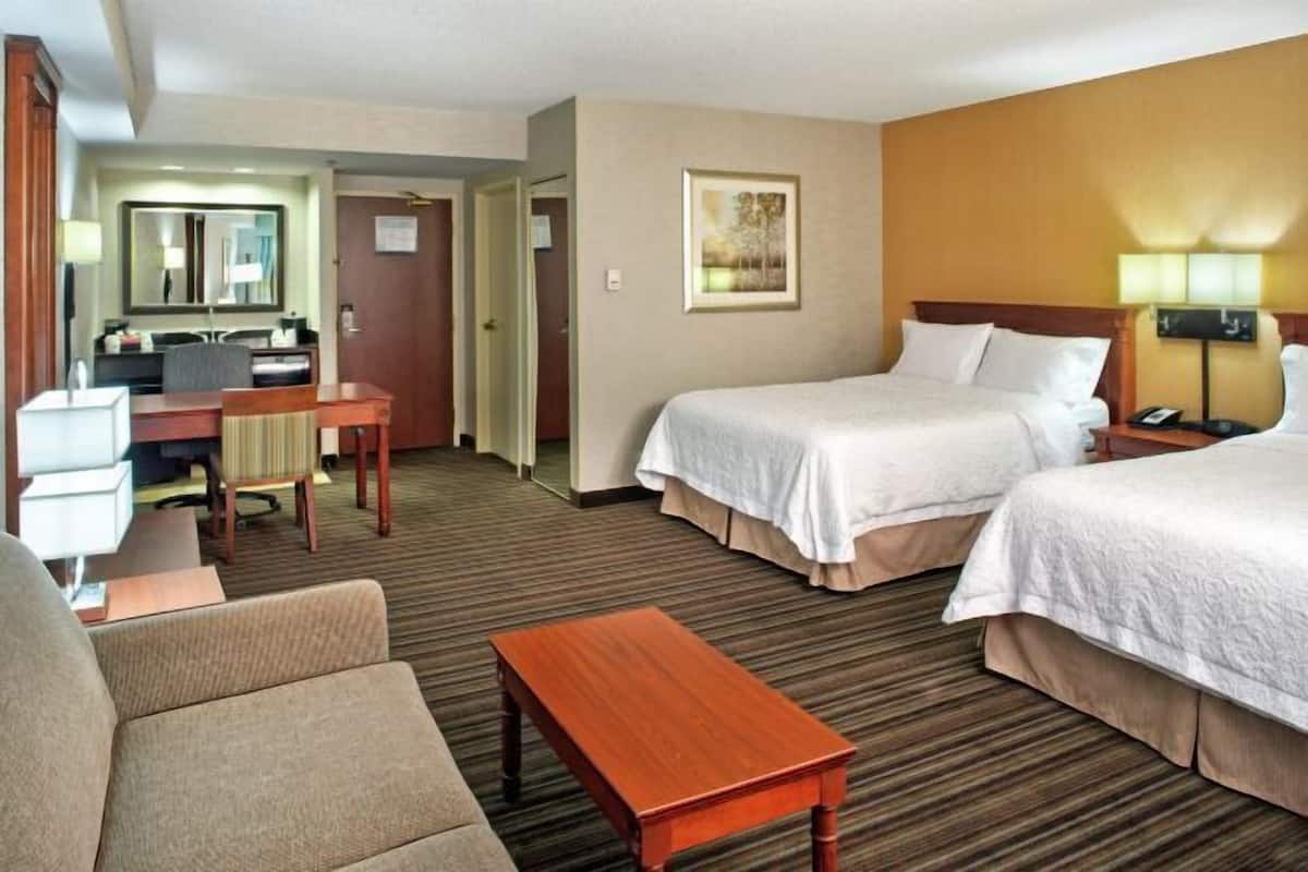 Premium bedding, desk, laptop workspace, blackout curtains