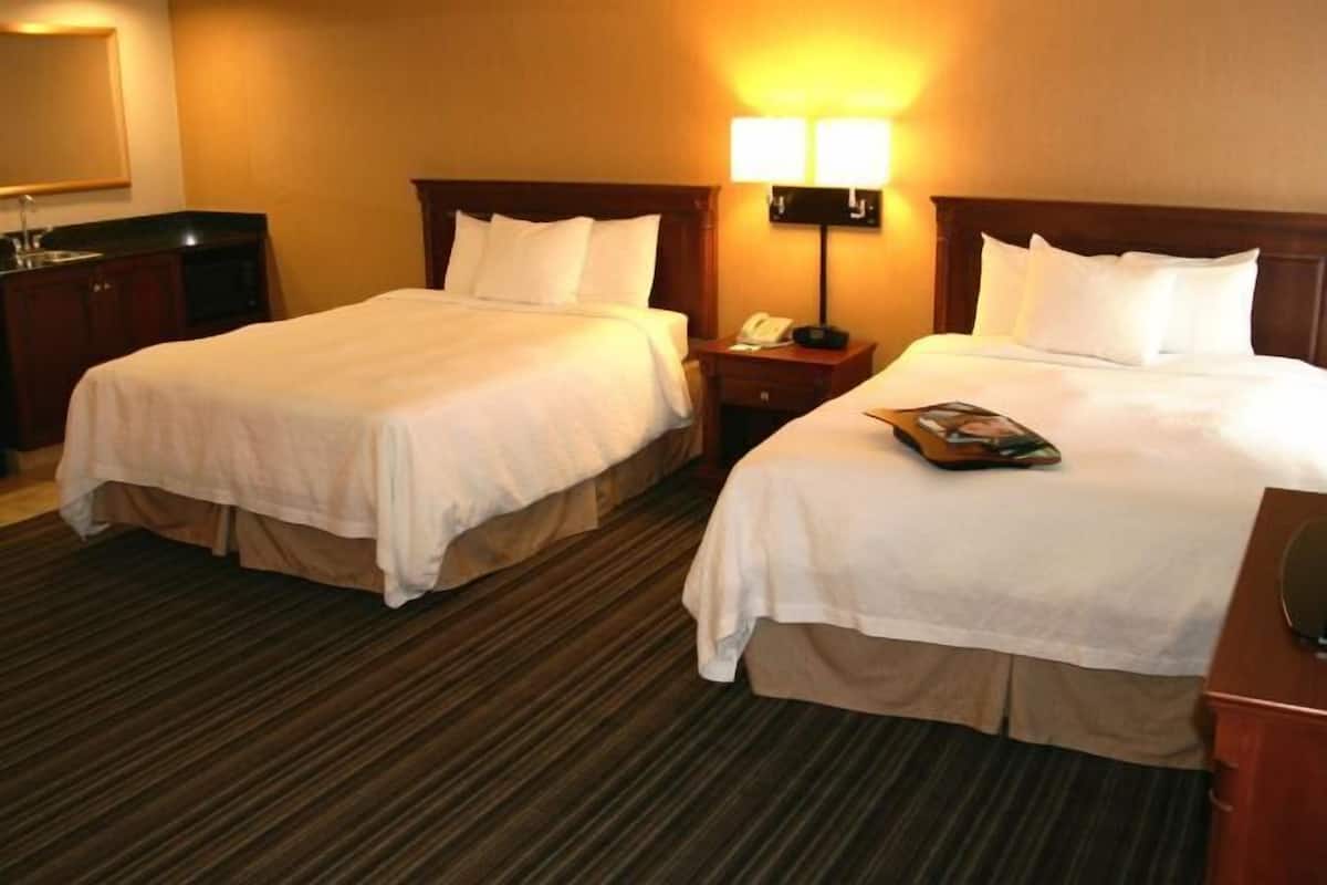 Premium bedding, desk, laptop workspace, blackout curtains