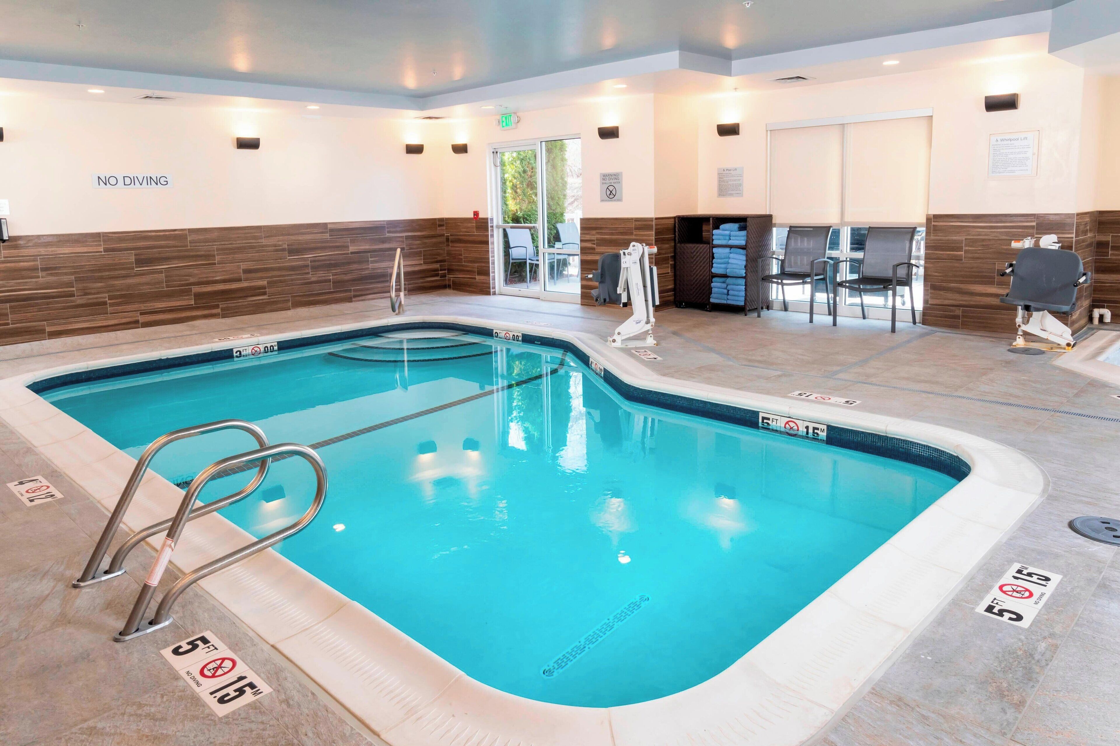 indoor pool, open 8:00 am to 10:00 pm, pool umbrellas, pool loungers