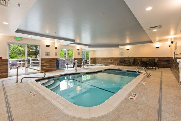 Indoor pool, open 8:00 AM to 10:00 PM, pool umbrellas, pool loungers