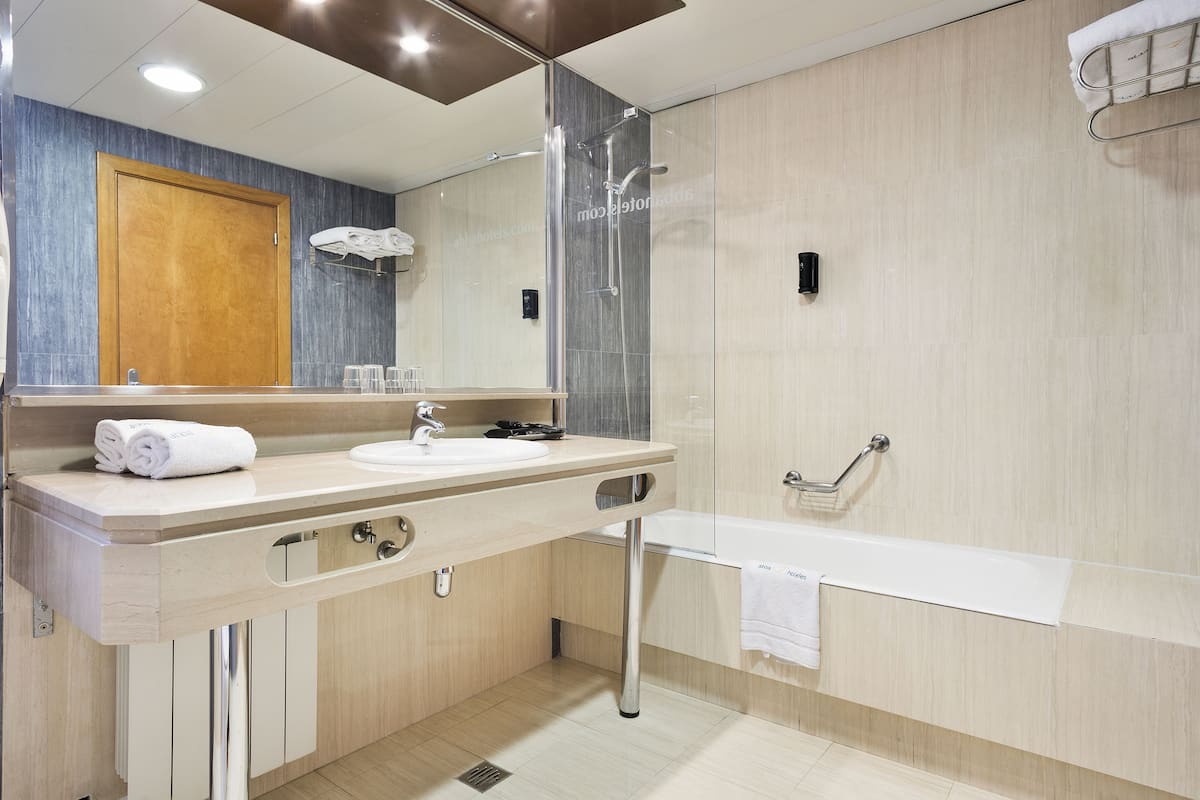 shower, eco-friendly toiletries, hair dryer, towels