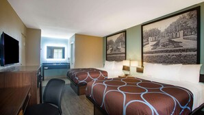 A hotel room with two beds, a desk, a chair, a TV, and large framed pictures on the wall. - Super 8 by Wyndham Mobile I-65 (Mobile)