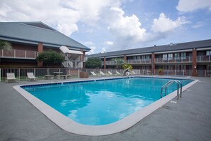 Seasonal outdoor pool, pool loungers