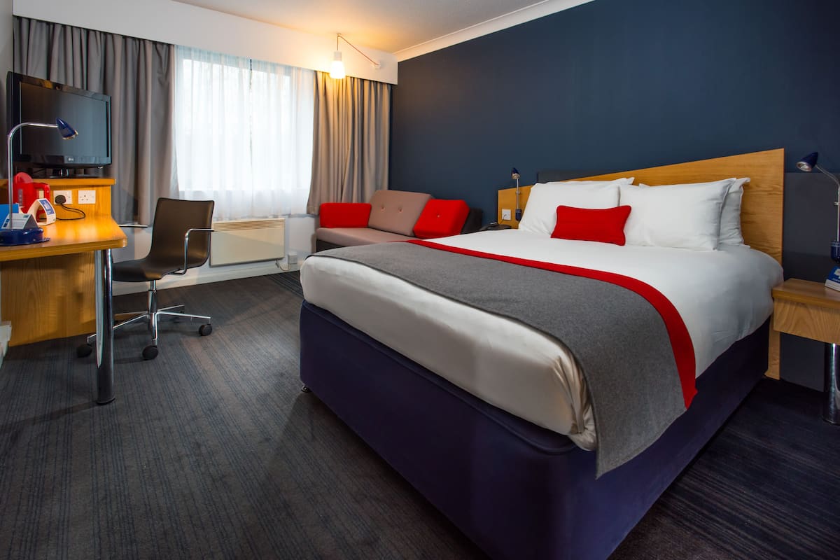 desk, laptop workspace, blackout curtains, iron/ironing board