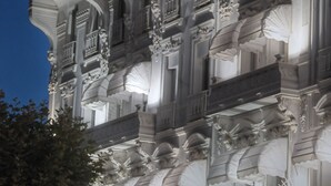 A grand building with ornate architectural details, including columns and balconies, and flags on top. - Hotel Splendid Cannes (Cannes)
