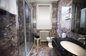 Shower, free toiletries, hair dryer, slippers