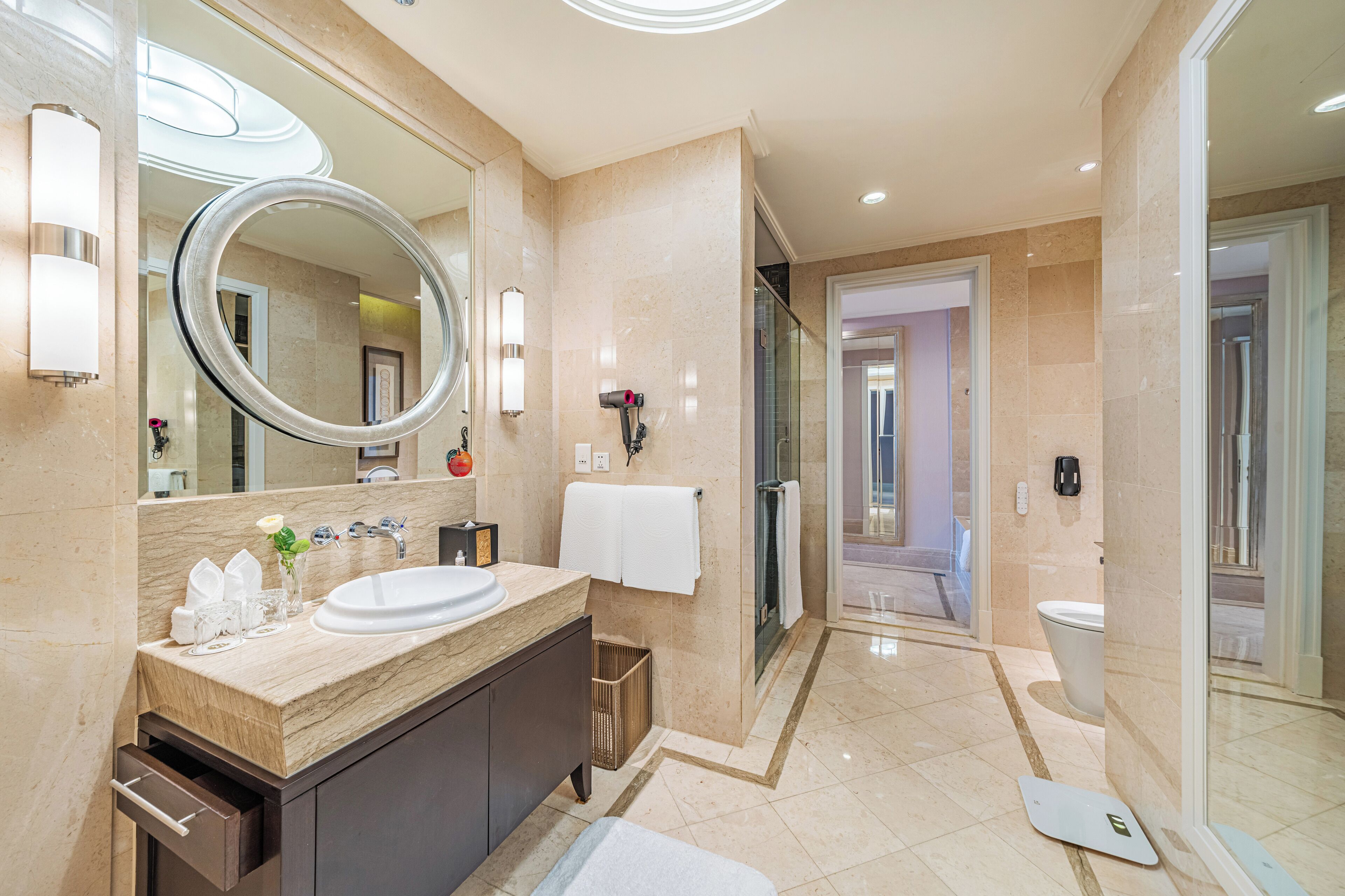 superior suite | bathroom | hair dryer, bathrobes, slippers, towels