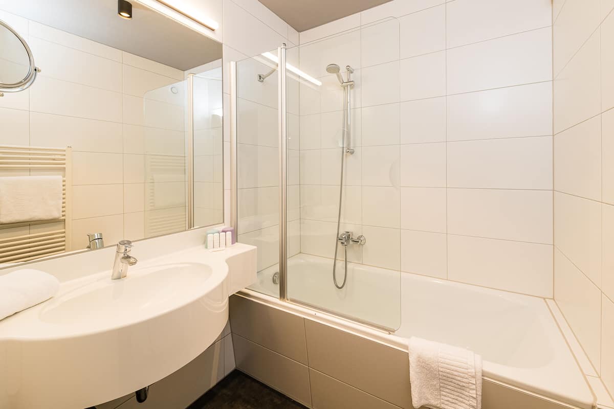 comfort room | bathroom | free toiletries, hair dryer, bathrobes, slippers