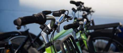 A row of bicycles parked closely together.