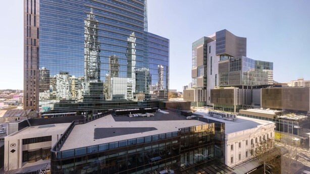 A modern building with a glass facade and a flat roof. - Oaks Perth Hotel (Perth)