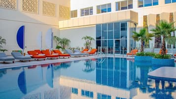 Outdoor pool, pool umbrellas, sun loungers