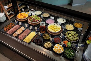 Daily buffet breakfast (NZD 37 per person)