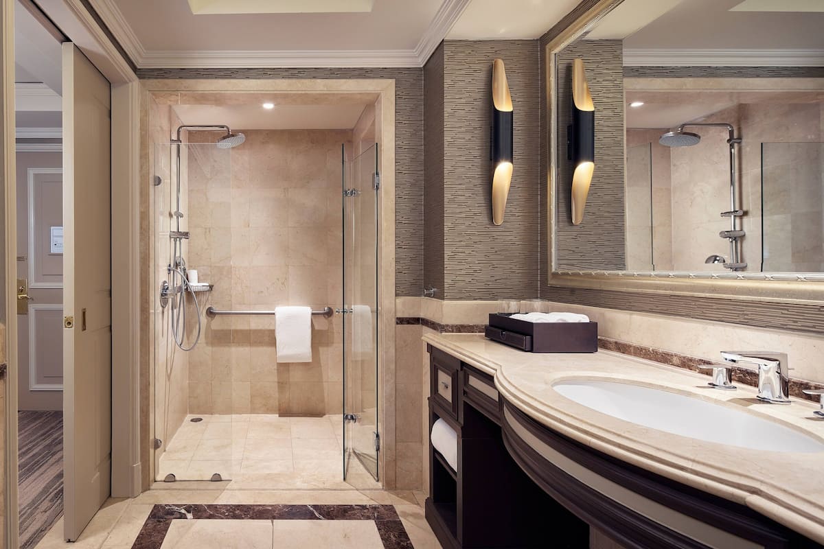 designer toiletries, hair dryer, bathrobes, slippers