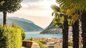 A coastal town with a view of the sea and mountains.