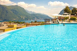 Indoor pool, seasonal outdoor pool, pool umbrellas, pool loungers