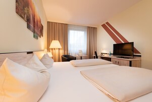 Hypo-allergenic bedding, desk, blackout drapes, soundproofing