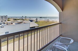 Relax on the balcony with a clear view of the beach and ocean.
